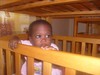 Volunteer with abandoned babies in Kenya
