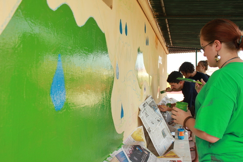 India community volunteer painting wall